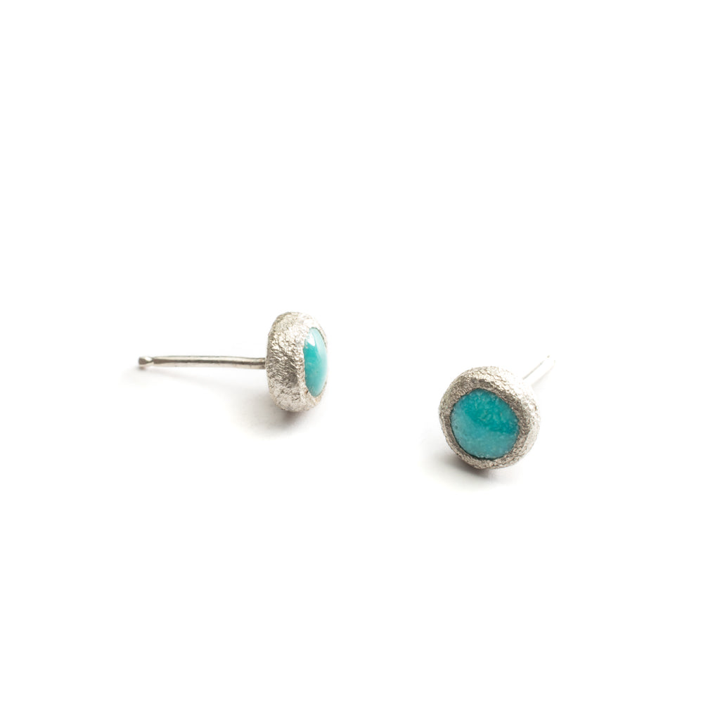 Understated studs in turquoise or opal both held in sterling silver with sterling posts